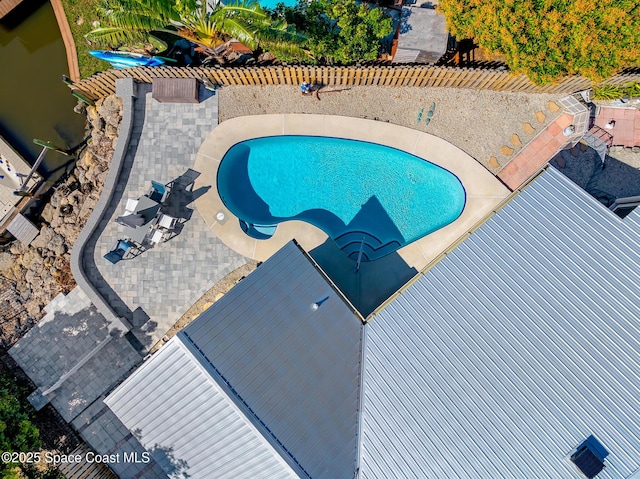 view of swimming pool with a patio