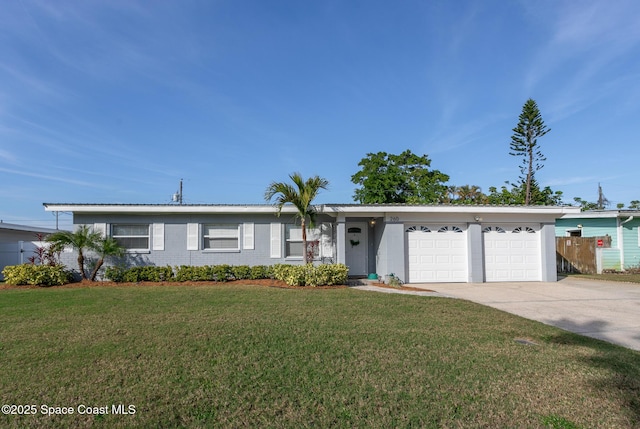 single story home featuring a garage and a front lawn