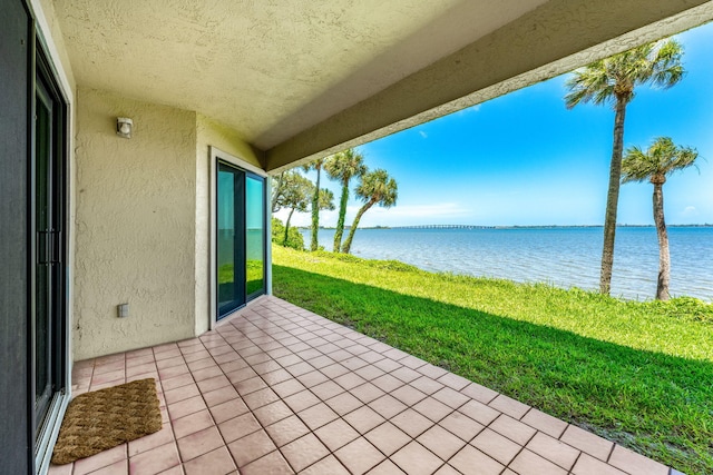 view of patio / terrace featuring a water view