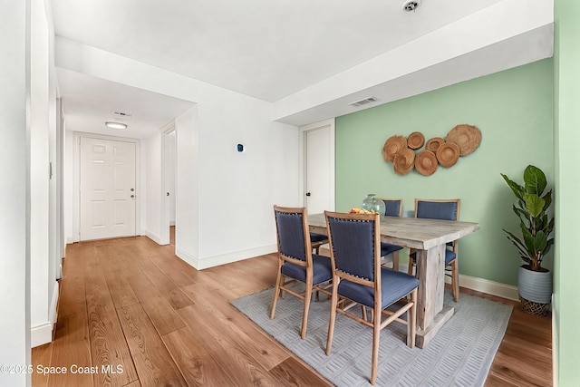 dining room with light wood-type flooring