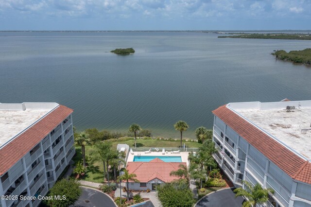 birds eye view of property with a water view