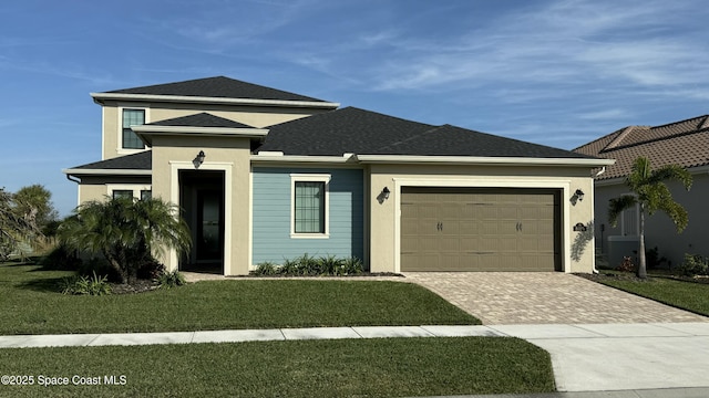 view of front facade with a garage and a front yard