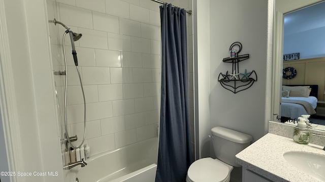 full bathroom featuring shower / bath combo, vanity, and toilet