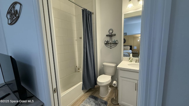 full bathroom with shower / tub combo, vanity, and toilet