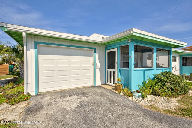 single story home with a garage