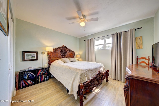 bedroom with ceiling fan and light wood-type flooring