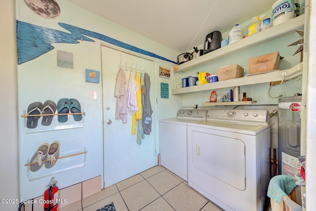 laundry area featuring light tile patterned floors and independent washer and dryer