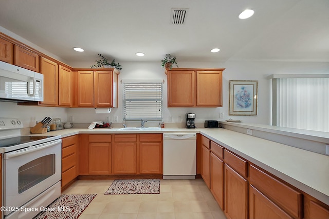 kitchen with sink and white appliances