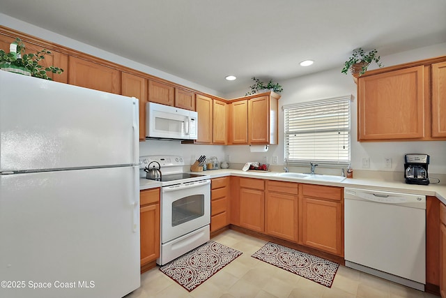 kitchen with sink and white appliances