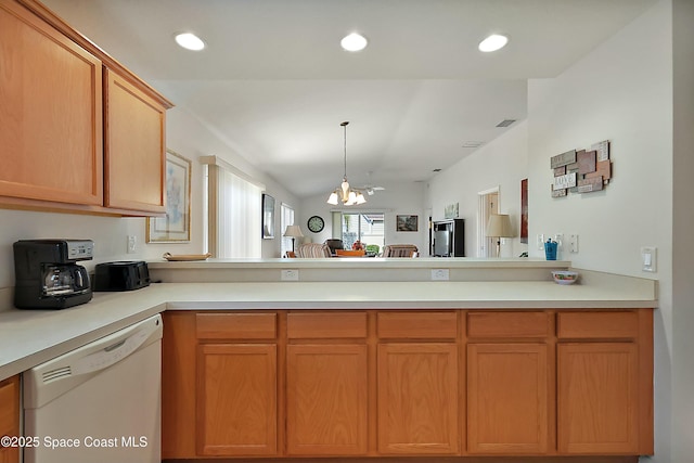 kitchen with an inviting chandelier, white dishwasher, and kitchen peninsula