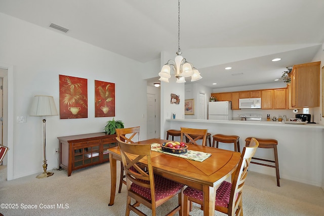 dining room with a notable chandelier