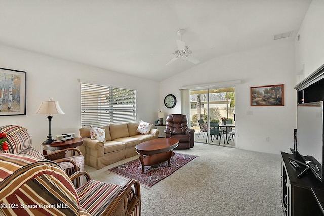 living room with vaulted ceiling, carpet flooring, and ceiling fan