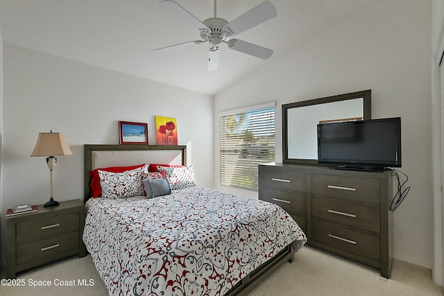 bedroom with light carpet, vaulted ceiling, and ceiling fan