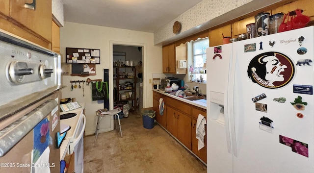 kitchen with sink and white appliances