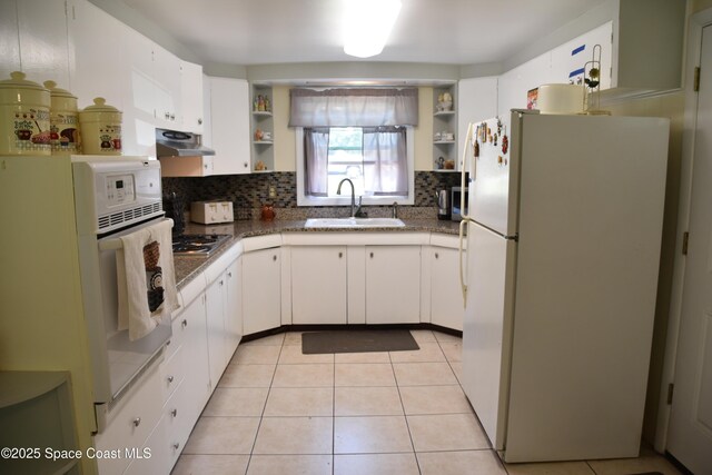 423 Longfellow Blvd, Lakeland, FL 33803 - kitchen with white appliances, open shelves, a sink, and tasteful backsplash