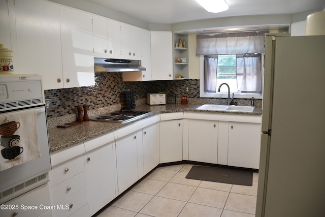 423 Longfellow Blvd, Lakeland, FL 33803 - kitchen featuring white appliances, a sink, under cabinet range hood, and tasteful backsplash