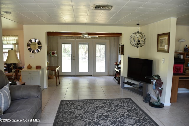 423 Longfellow Blvd, Lakeland, FL 33803 - living room featuring plenty of natural light, light tile patterned flooring, and french doors
