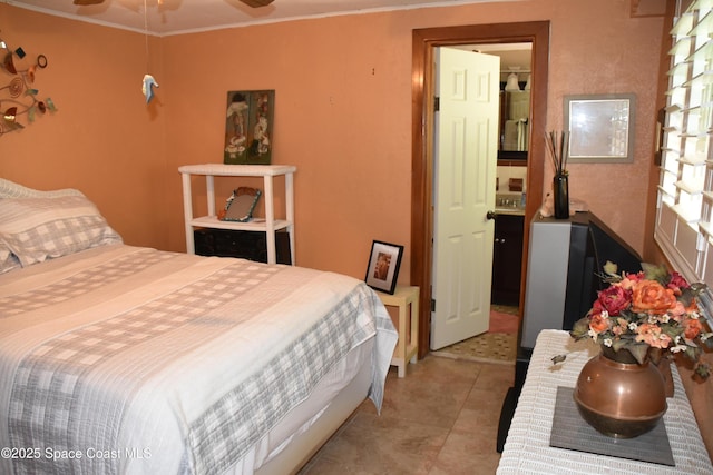 423 Longfellow Blvd, Lakeland, FL 33803 - bedroom with ornamental molding and light tile patterned floors