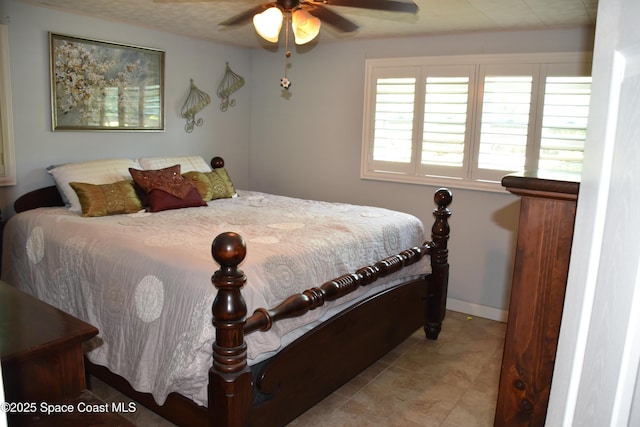423 Longfellow Blvd, Lakeland, FL 33803 - bedroom featuring baseboards and a ceiling fan