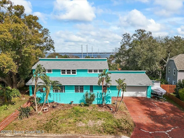 back of house with a garage