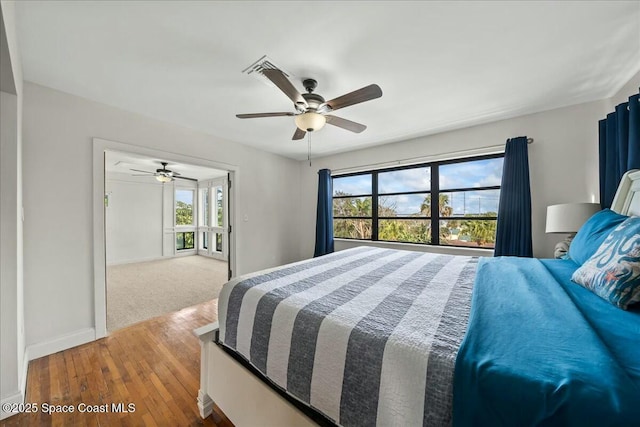 bedroom featuring ceiling fan and hardwood / wood-style floors