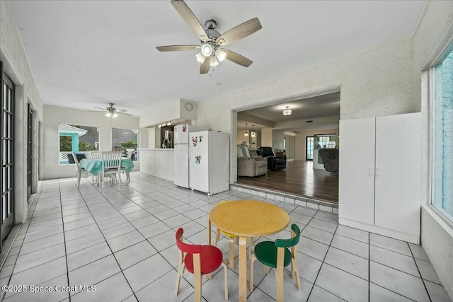 interior space with ceiling fan and a healthy amount of sunlight