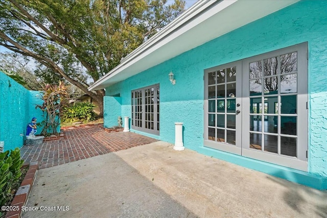 view of patio featuring french doors