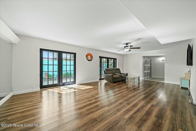 interior space with dark hardwood / wood-style flooring, french doors, and ceiling fan