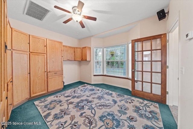 carpeted bedroom with ceiling fan