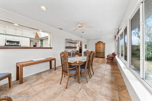 dining room featuring ceiling fan