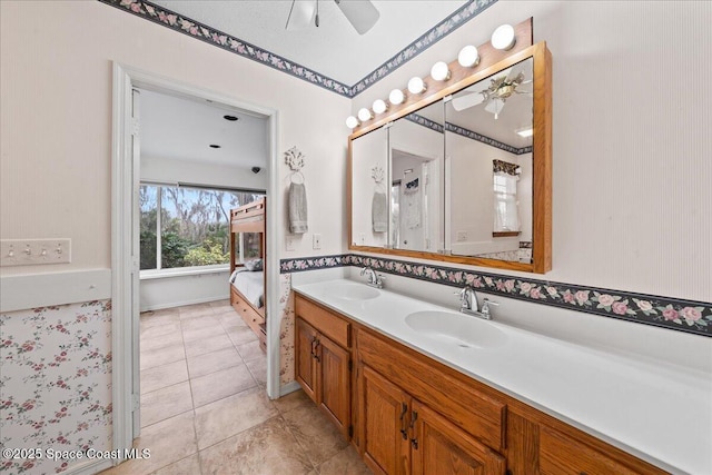 bathroom featuring ceiling fan, vanity, and tile patterned floors