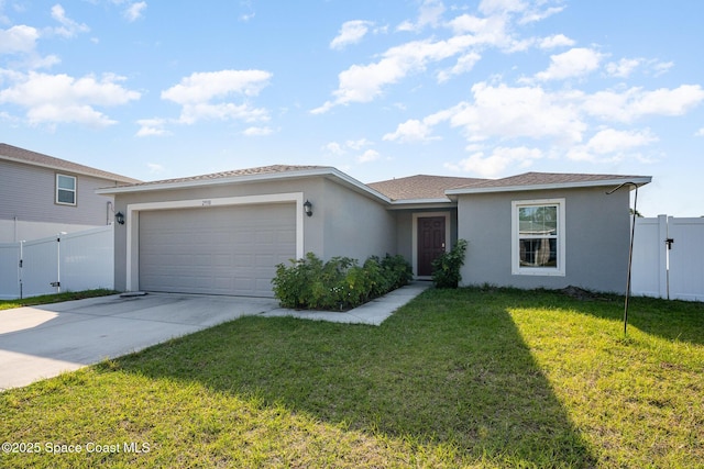 ranch-style house featuring a garage and a front yard