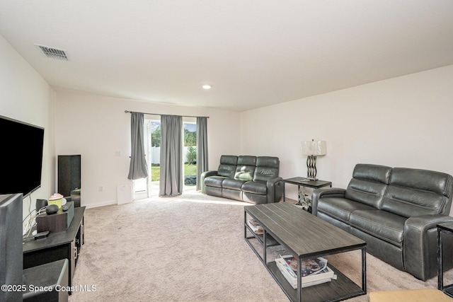 living room featuring light carpet