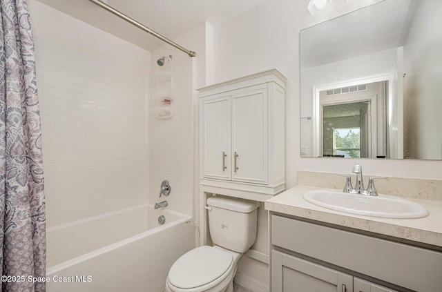 full bathroom with vanity, toilet, and shower / bath combo with shower curtain