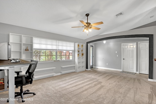 carpeted office with ceiling fan and vaulted ceiling