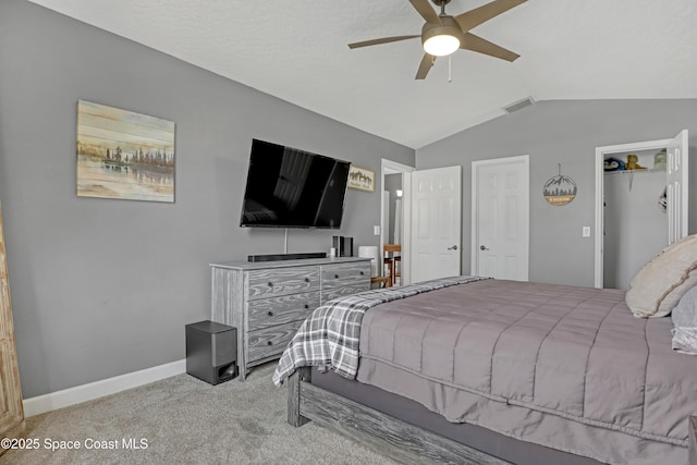 carpeted bedroom with lofted ceiling and ceiling fan