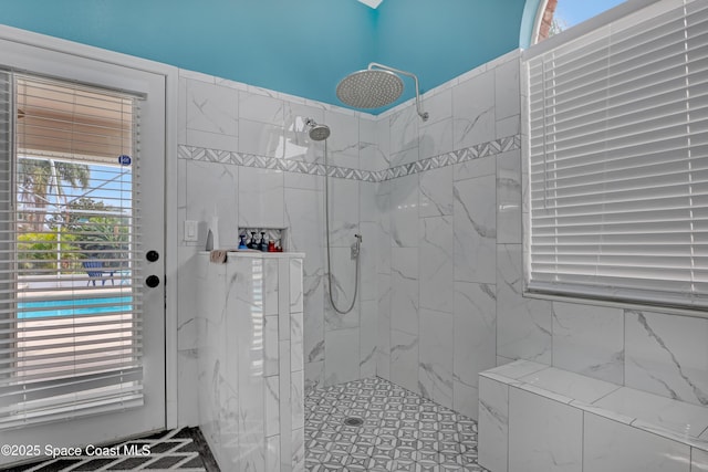 bathroom with tiled shower