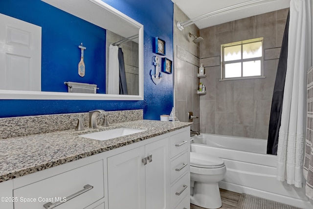 full bathroom with toilet, vanity, shower / bathtub combination with curtain, and hardwood / wood-style flooring