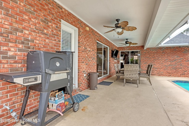 view of patio featuring ceiling fan