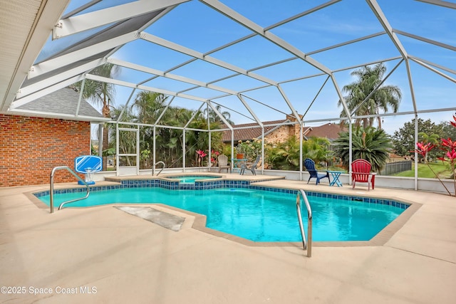 view of swimming pool featuring an in ground hot tub, a lanai, and a patio area