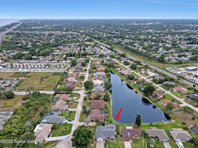 bird's eye view with a water view