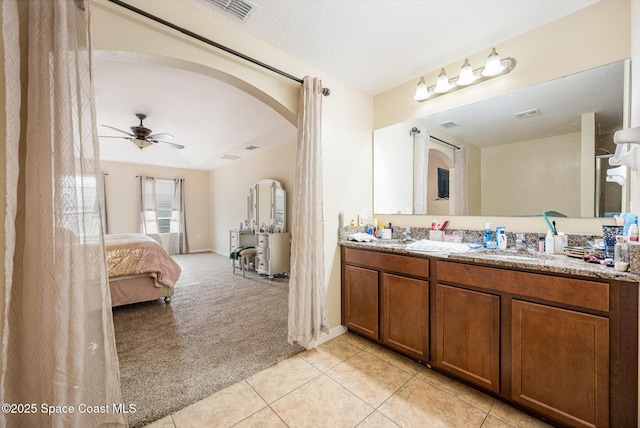 bathroom with ceiling fan, tile patterned floors, and vanity