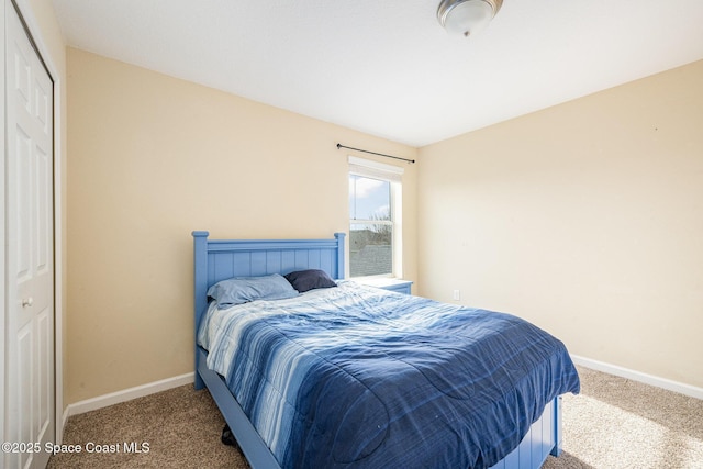 carpeted bedroom with a closet