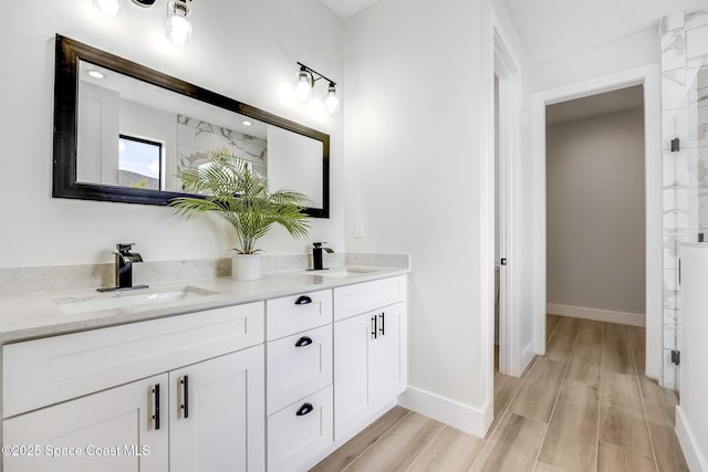 bathroom featuring vanity and wood-type flooring