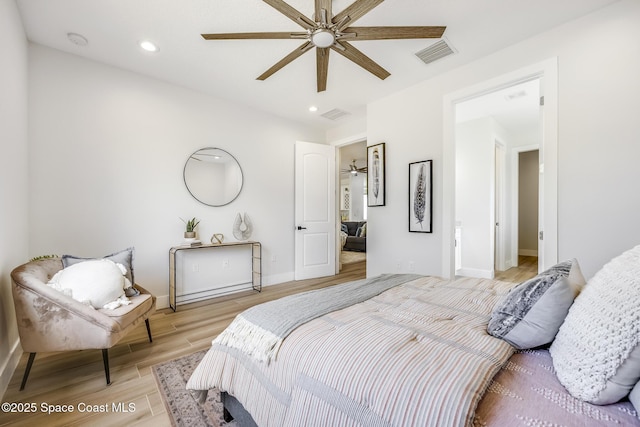 bedroom featuring light hardwood / wood-style flooring and ceiling fan