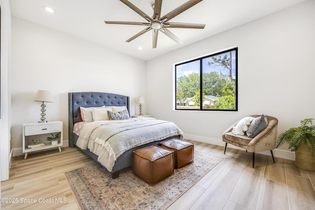 bedroom featuring light hardwood / wood-style floors and ceiling fan