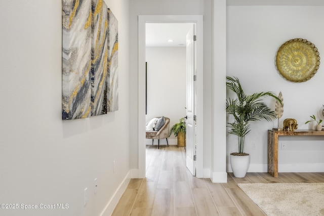 corridor featuring light hardwood / wood-style floors