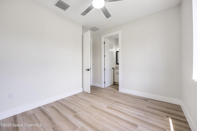 unfurnished room featuring ceiling fan and light hardwood / wood-style flooring