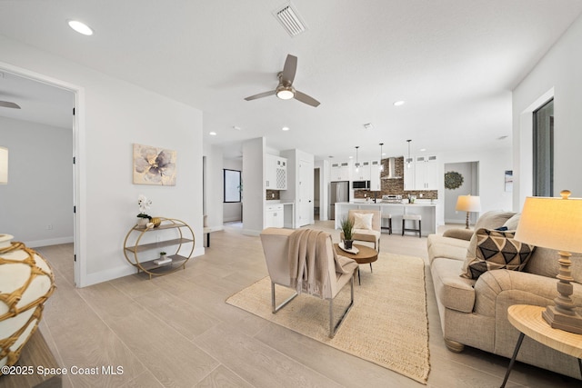 living room featuring ceiling fan