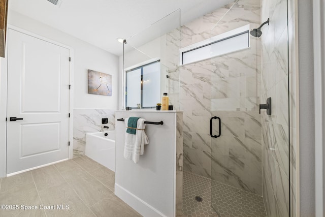 bathroom with independent shower and bath and tile walls